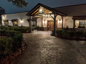 Night view of new Grand Entrance decorative concrete at Olde Mecklenburg Brewery in Charlotte, NC, using Bomanite Imprint Systems featuring the Running Bond Belgian Block pattern installed by Carolina Bomanite.