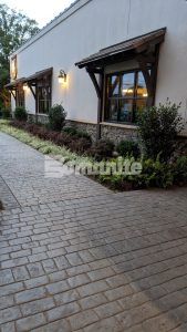 View of the side of the building decorative concrete at Olde Mecklenburg Brewery in Charlotte, NC, using Bomanite Imprint Systems featuring the Running Bond Belgian Block pattern installed by Carolina Bomanite.