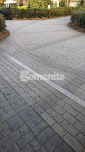 Long view of paths of decorative concrete at Olde Mecklenburg Brewery in Charlotte, NC, using Bomanite Imprint Systems featuring the Running Bond Belgian Block pattern installed by Carolina Bomanite.