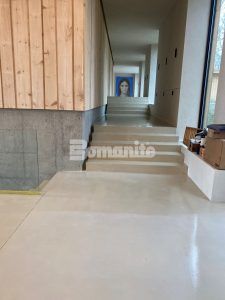 Long view of multiple sets of stairs at a residence in New Hampshire featuring Bomanite Custom Polishing Systems using Bomanite Belcolore and installed by Bomanite licensee Premier Concrete Construction LLC.
