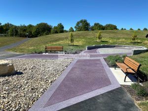 View towards hill at Mosaic Life Care Cancer Center Ribbon Walk Pavilion in St. Joseph, MO, featuring Bomanite Revealed decorative concrete installed by Bomanite Licensee Musselman and Hall Contractors, LLC.