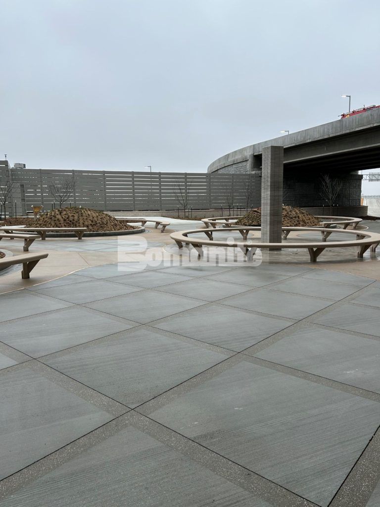 Close up towards fountain at Kansas City Airport in Kansas City, MO, featuring Bomanite Sandscape Texture decorative concrete installed by Musselman & Hall Contractors.
