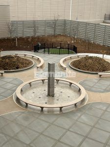 Closer overhead view with fountain in the center at Kansas City Airport in Kansas City, MO, featuring Bomanite Sandscape Texture decorative concrete installed by Musselman & Hall Contractors.