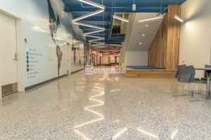 Hallway towards back of stairs on the right at John Diemer Elementary in Overland Park, KS, featuring Bomanite Custom Polishing Systems using Bomanite Renaissance installed by Bomanite Licensee Musselman and Hall Contractors, LLC.