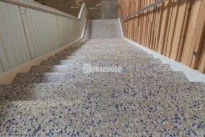At the top of the stairs looking down at John Diemer Elementary in Overland Park, KS, featuring Bomanite Custom Polishing Systems using Bomanite Renaissance installed by Bomanite Licensee Musselman and Hall Contractors, LLC.