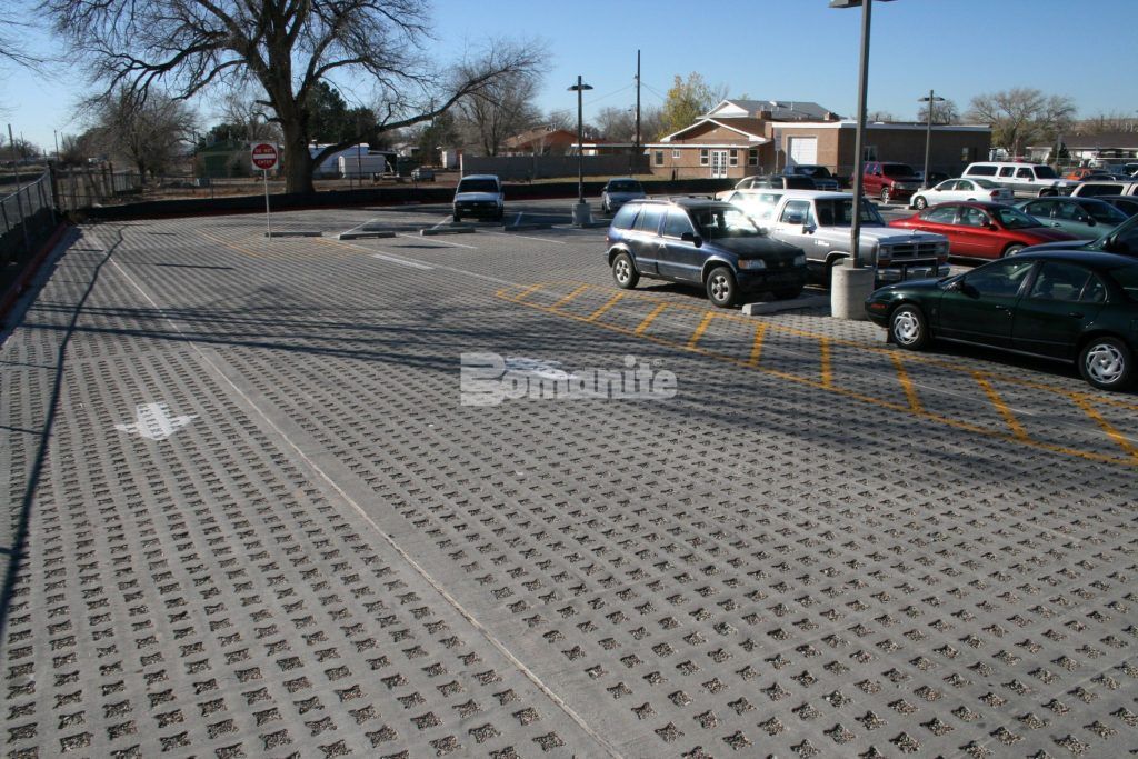 Navajo Elementary Parking lot in Albuquerque, NM, featuring Stone Filled Grasscrete Molded Pulp Former System pervious concrete.